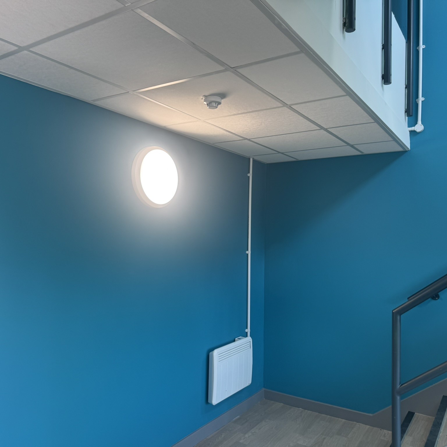 mk recycling stair case Apprentice electrician at work connecting wires