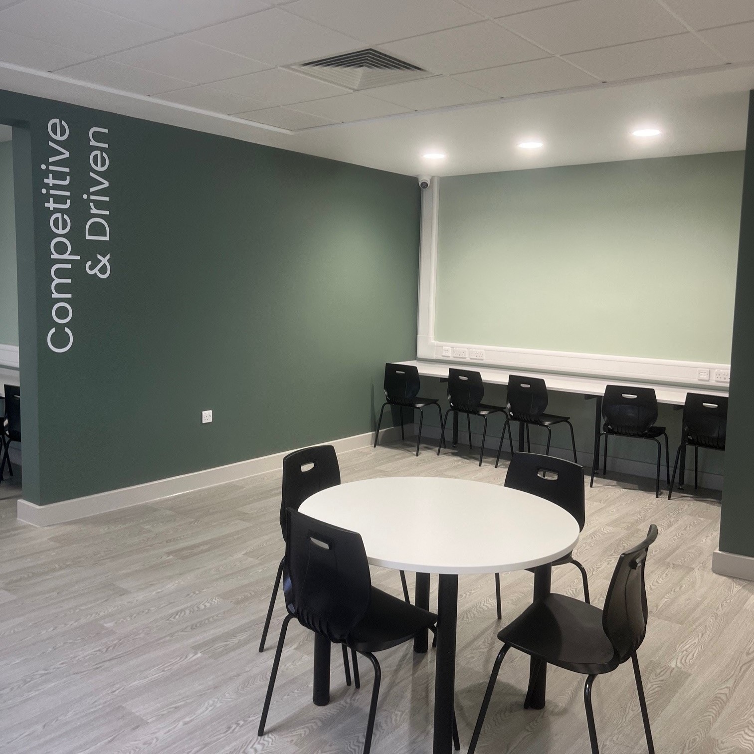 hospital corridor with mural on the wall
