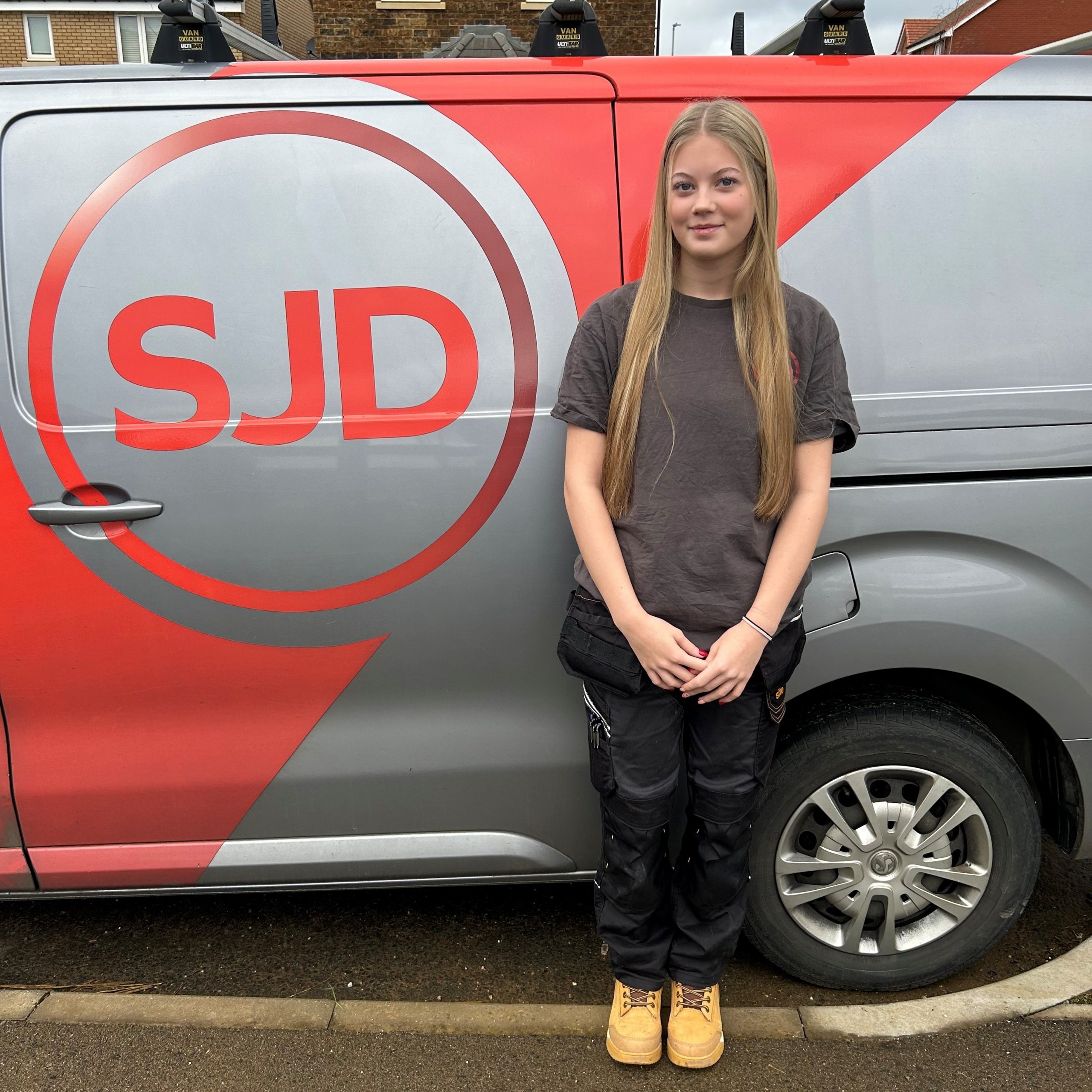 Apprentice electrician standing outside SJD's office